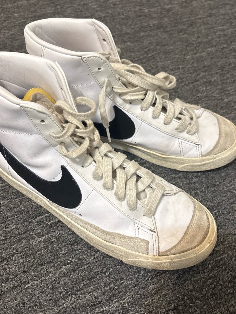 Nike White High-Top Sneakers with Black Swoosh